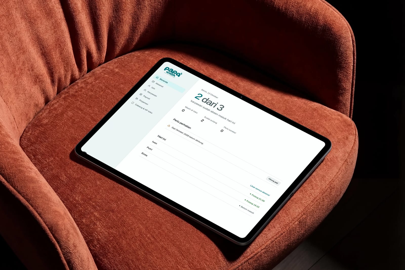 Papawash HRIS dashboard on a tablet, showing today's attendance count, a payroll reminder and the list of staff